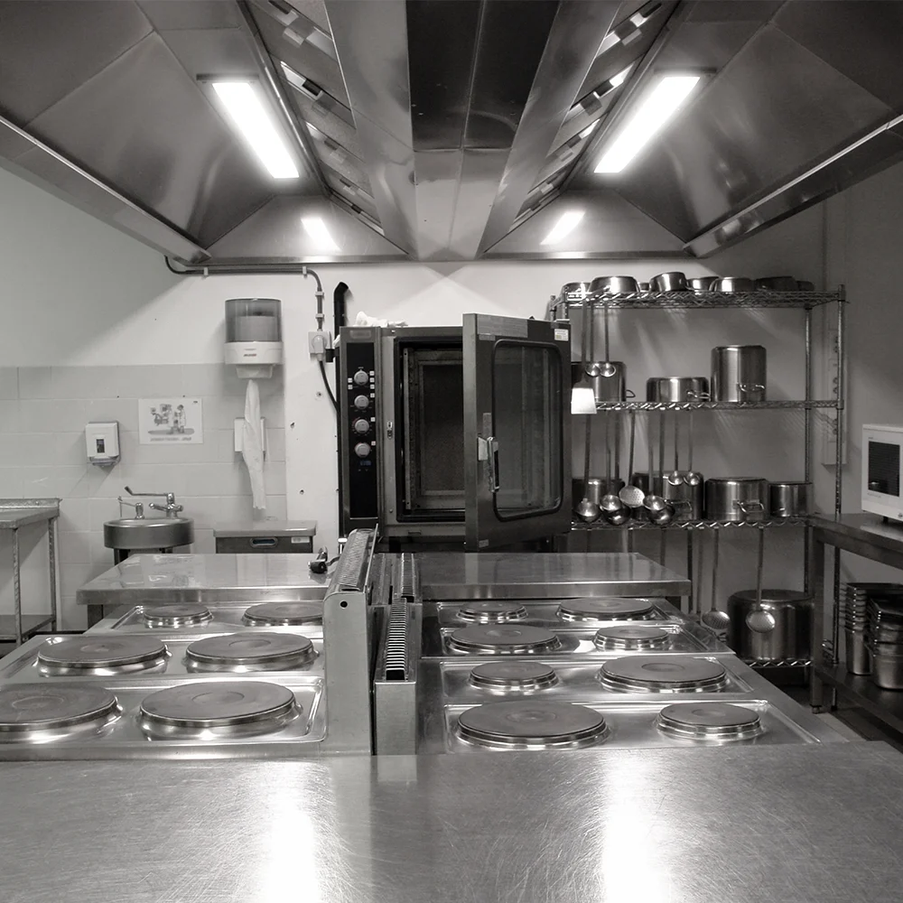 Industrial kitchen extractor hood with LED luminaires