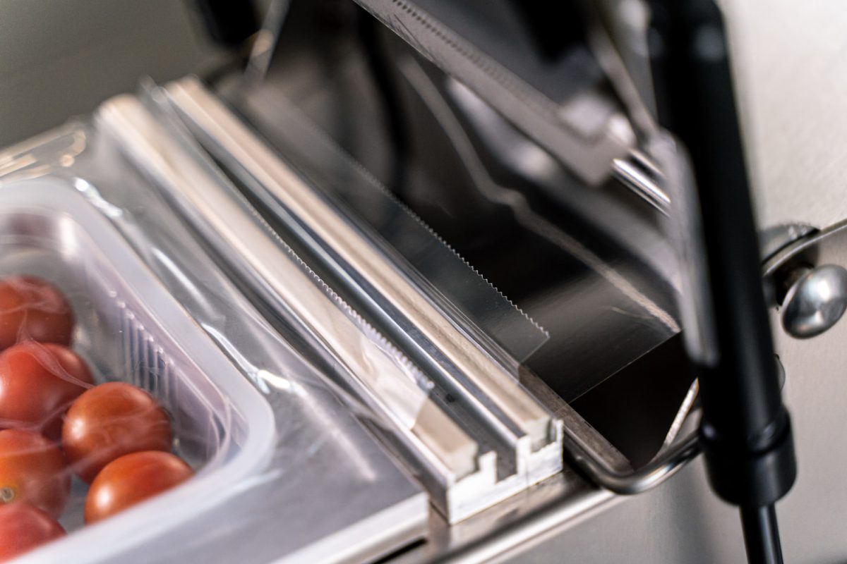 Close-up of a tray being sealed on the RP-RA200 tray sealer